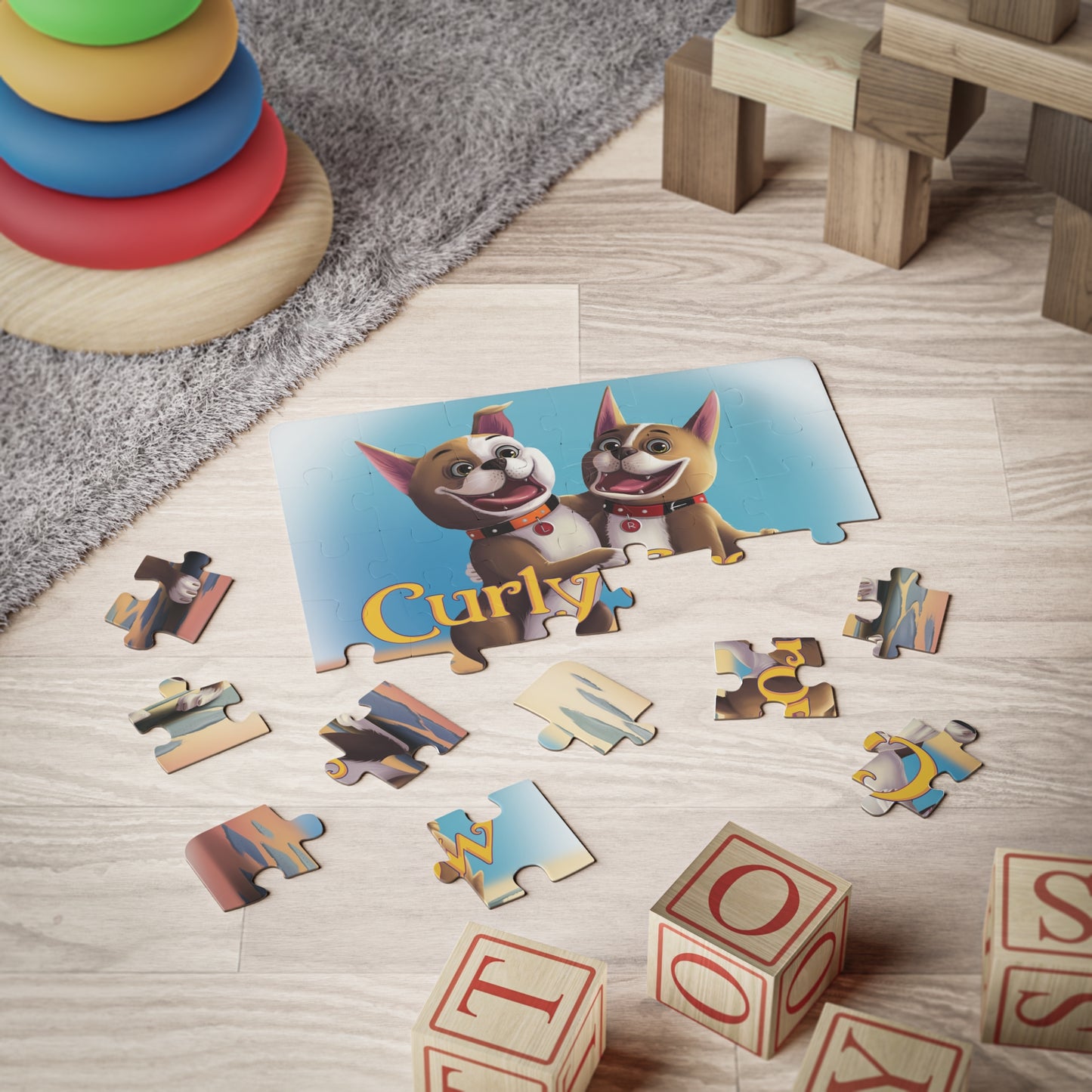 Rooger and Loki puzzle pieces scattered on a table, featuring colorful illustrations of the Boston terriers.