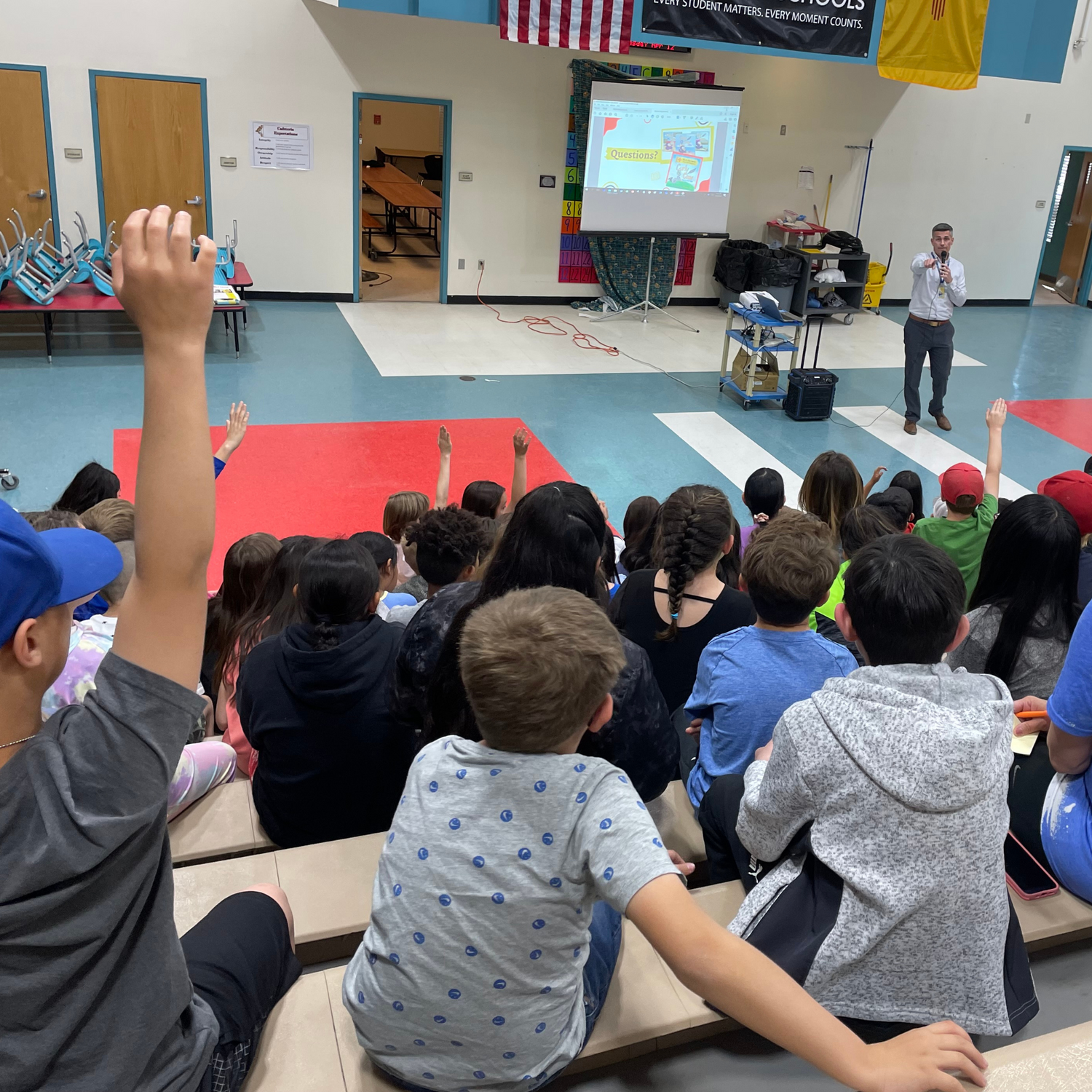 Author Nicholas Aragon in front of a group of elementary kids grades kindergarten to fifth grade learning about my journey as an author