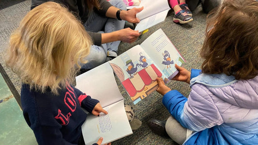 Kids reading Curly Crow Books in a classroom