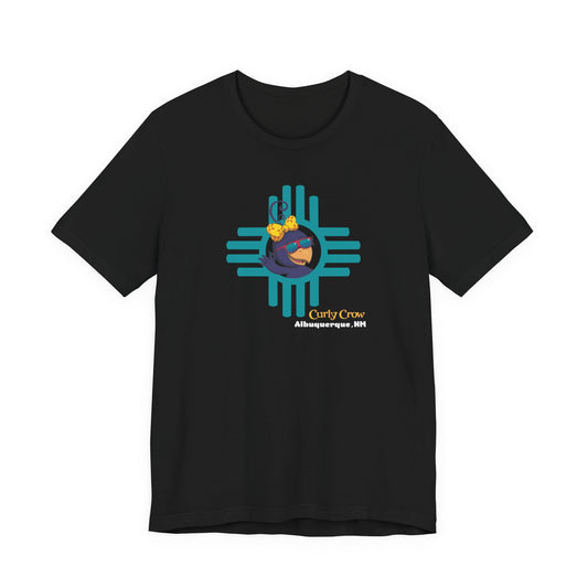 Black t-shirt with a colorful Curly Crow New Mexico Zia graphic design on a white background