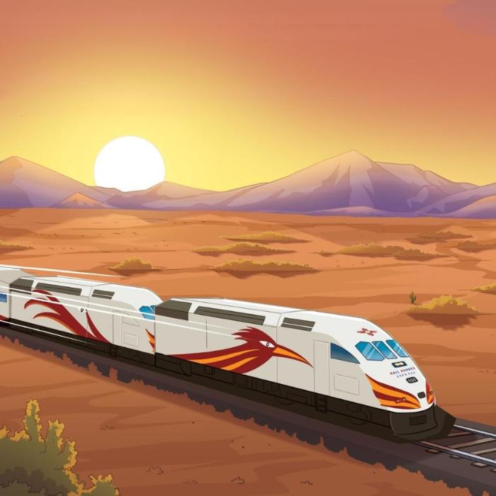 High-speed train with a colorful design on a desert track with mountains in the background