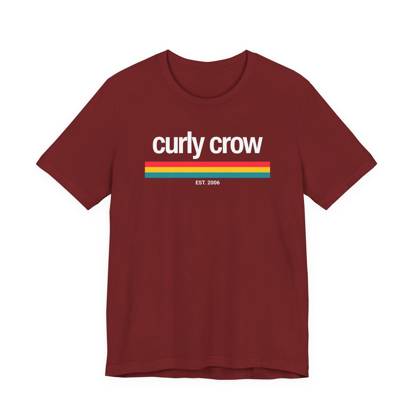 A maroon short-sleeve crewneck t-shirt with a retro-style graphic on the chest reading 'curly crow' in white, underlined by horizontal stripes in red, yellow, and light blue, with 'EST. 2006' printed below.