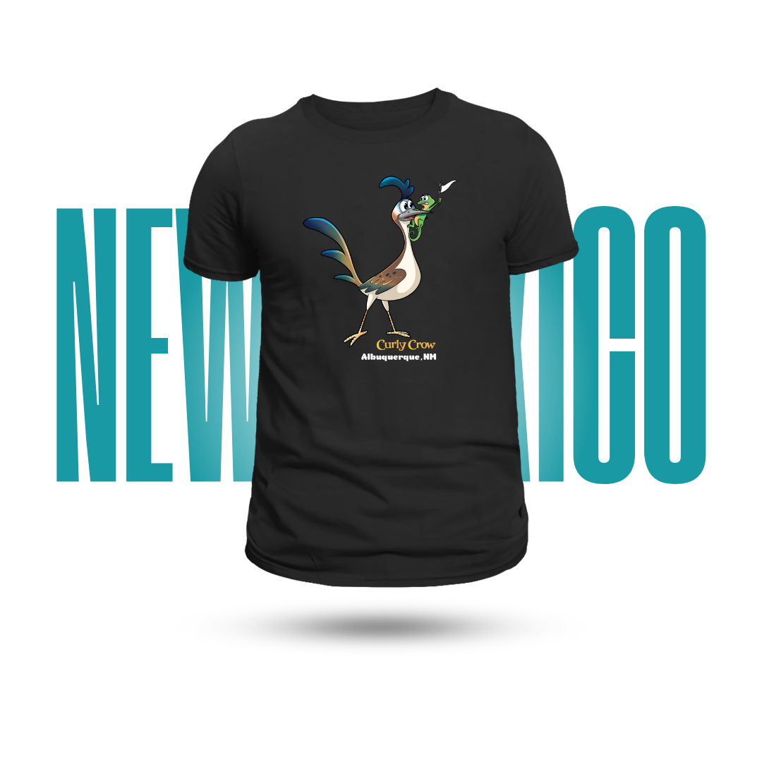 A black short-sleeve t-shirt featuring a colorful graphic of a Roadrunner cartoon character with a lizard in its mouth waiving a white flag, with 'Albuquerque, NM' printed below. The shirt is displayed against a white background with a large teal graphic behind it reading 'NEW MEXICO'.
